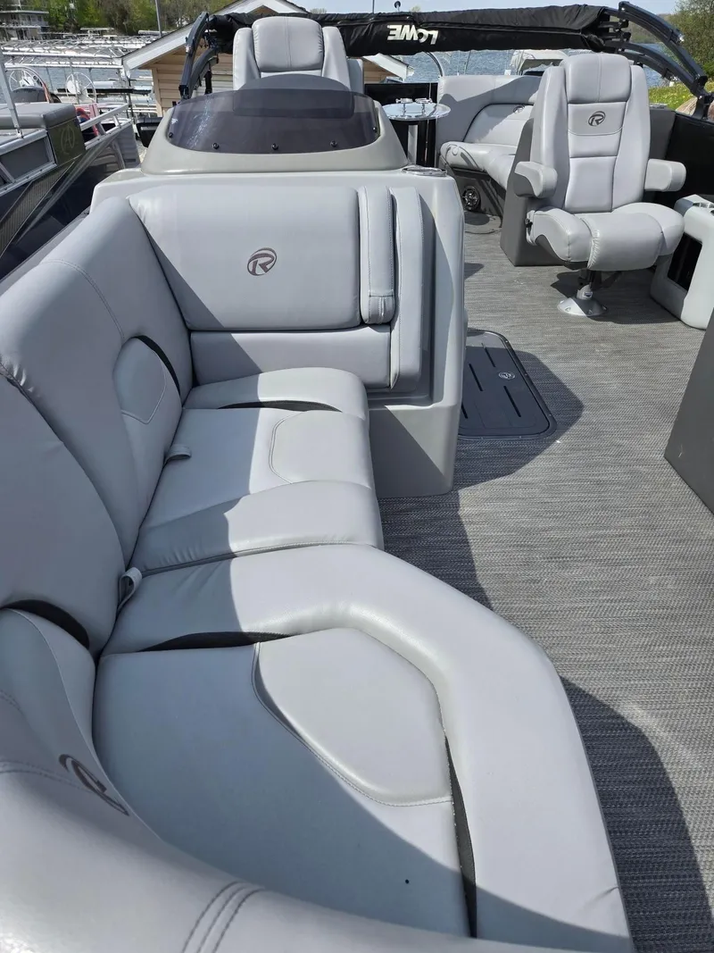 Slide: The Image of 2021 Lowe Retreat 230 High Performance boat interior with plush gray seating. - 8