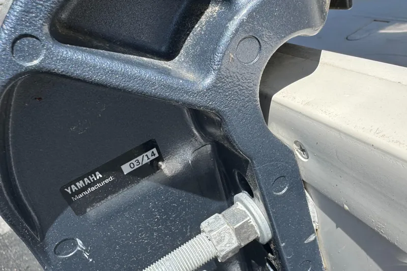 Slide: The Image of Close-up of a Yamaha motor mount on a 2014 Carolina Skiff 218 DLV boat. - 11