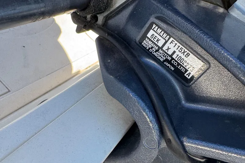 Slide: The Image of Yamaha motor on 2014 Carolina Skiff 218 DLV boat, close-up view. - 12