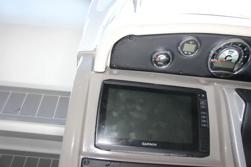 Slide: The Image of Dashboard of 2021 Crownline 294 CR boat with Garmin display and gauges. - 21