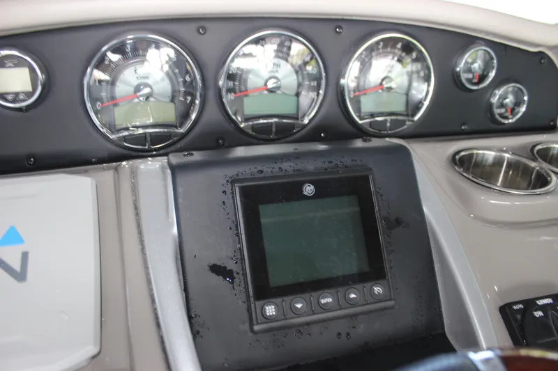 Slide: The Image of Dashboard of 2021 Crownline 294 CR boat with gauges and digital display. - 22
