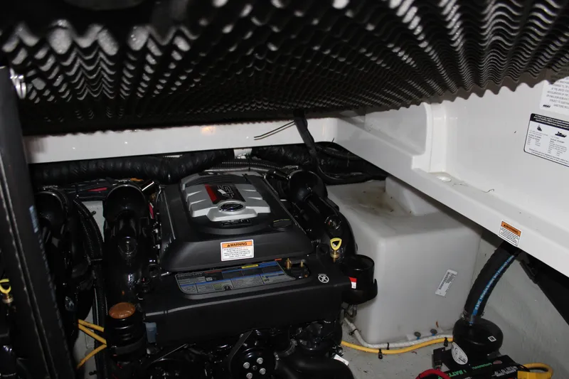 Slide: The Image of Engine compartment of 2021 Crownline 294 CR boat, showcasing detailed mechanical components. - 33