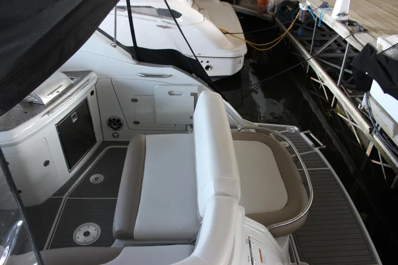 Slide: The Image of 2021 Crownline 294 CR boat interior with seating and deck area. - 38