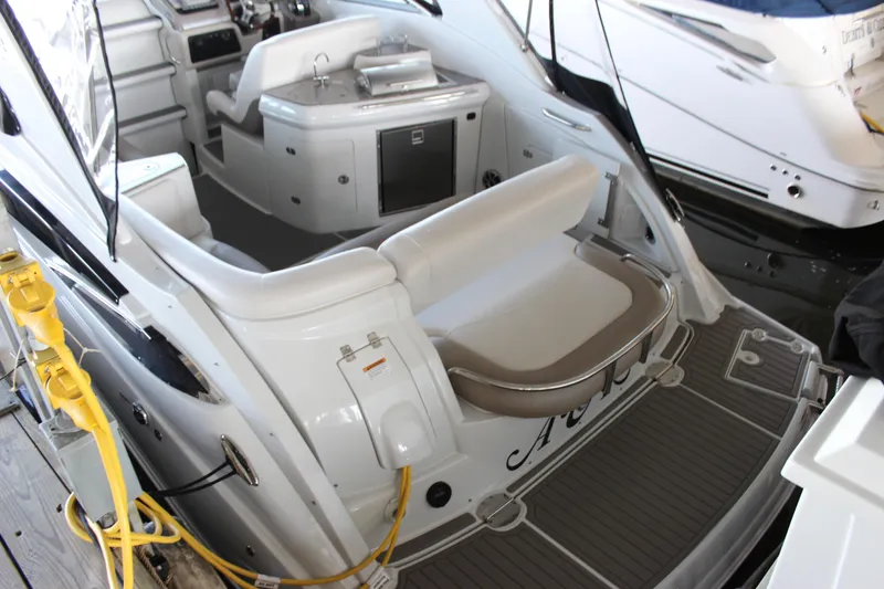Slide: The Image of 2021 Crownline 294 CR boat interior with seating and control panel. - 9