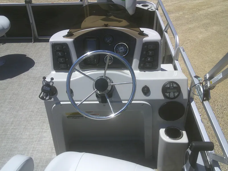 Slide: The Image of 2022 Qwest 816 Edge 4 Point Fish boat dashboard with steering wheel and controls. - 10
