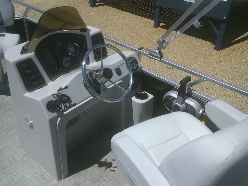 Slide: The Image of 2022 Qwest 816 Edge 4 Point Fish boat interior with steering wheel and controls. - 12