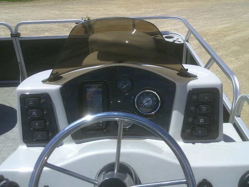 Slide: The Image of 2022 Qwest 816 Edge 4 Point Fish boat dashboard with steering wheel and control panel. - 16