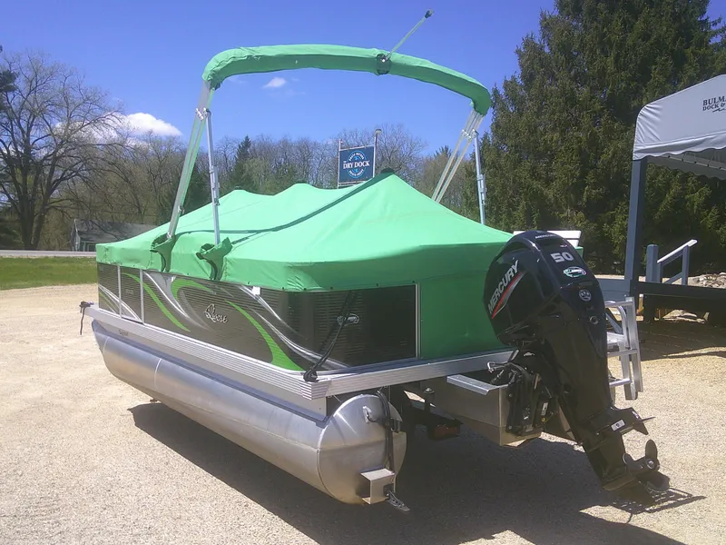 Slide: The Image of 2022 Qwest 816 Edge 4 Point Fish pontoon boat with green cover and Mercury outboard motor. - 19