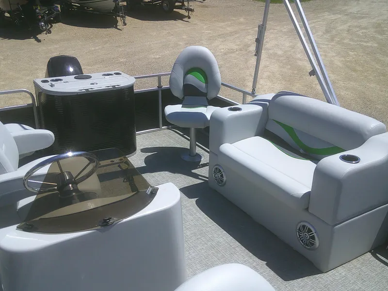 Slide: The Image of 2022 Qwest 816 Edge 4 Point Fish boat interior with seating and steering console. - 7