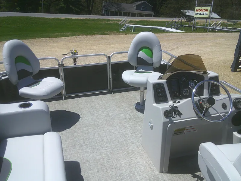 Slide: The Image of 2022 Qwest 816 Edge 4 Point Fish boat interior with seating and steering console. - 8