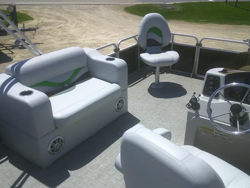 Slide: The Image of 2022 Qwest 816 Edge 4 Point Fish boat interior with seating and steering console. - 9