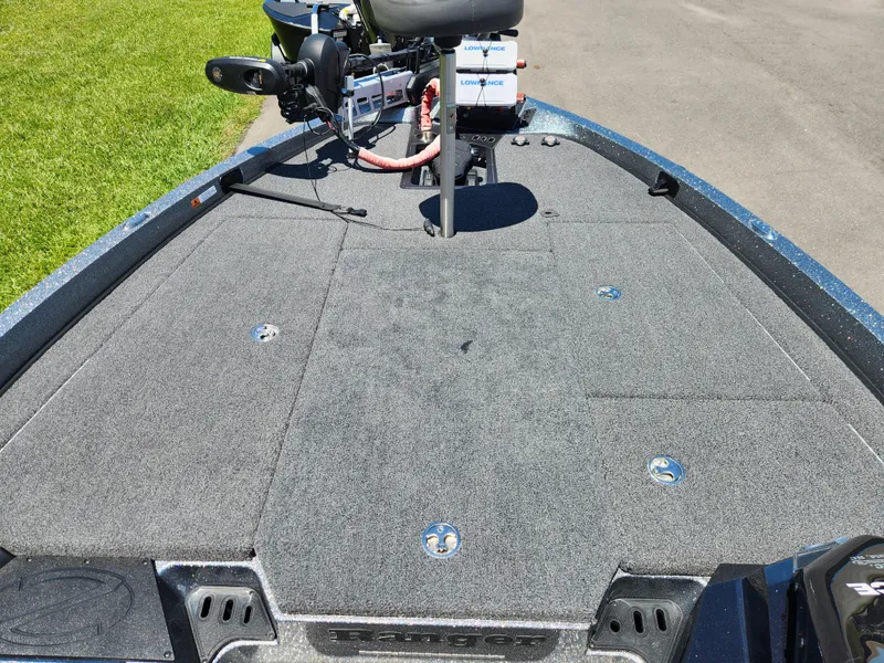 Slide: The Image of 2022 Ranger Z519 boat deck with trolling motor and carpeted surface. - 7