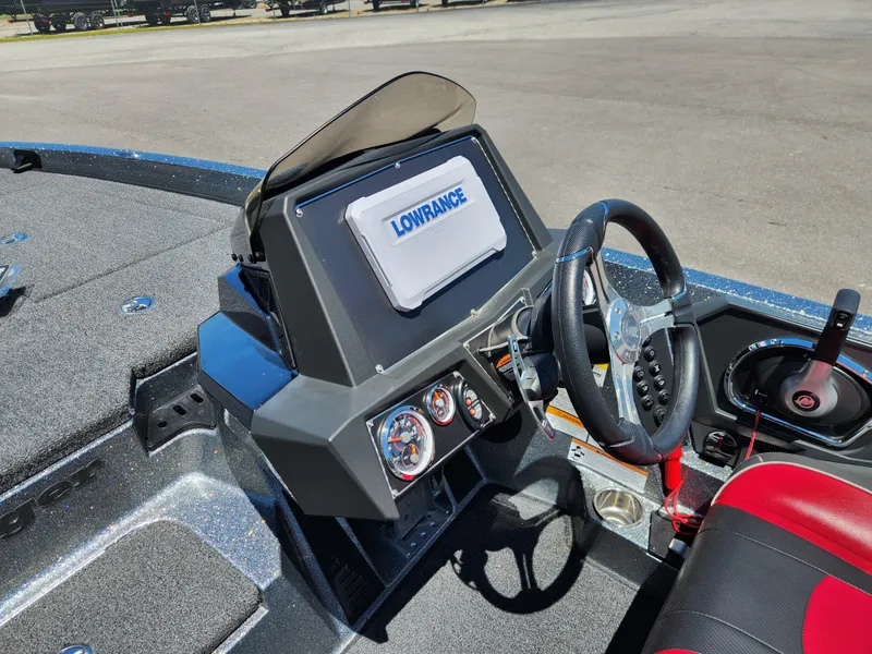 Slide: The Image of 2022 Ranger Z519 boat dashboard with Lowrance display and steering wheel. - 9
