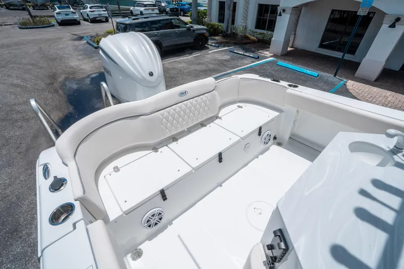 Slide: The Image of 2025 Sea Hunt Ultra 245 SE boat interior with seating and storage compartments. - 13