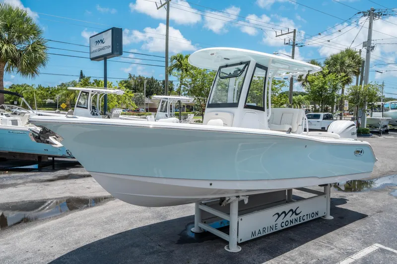 Slide: The Image of 2025 Sea Hunt Ultra 245 SE boat displayed at Marine Connection dealership. - 6