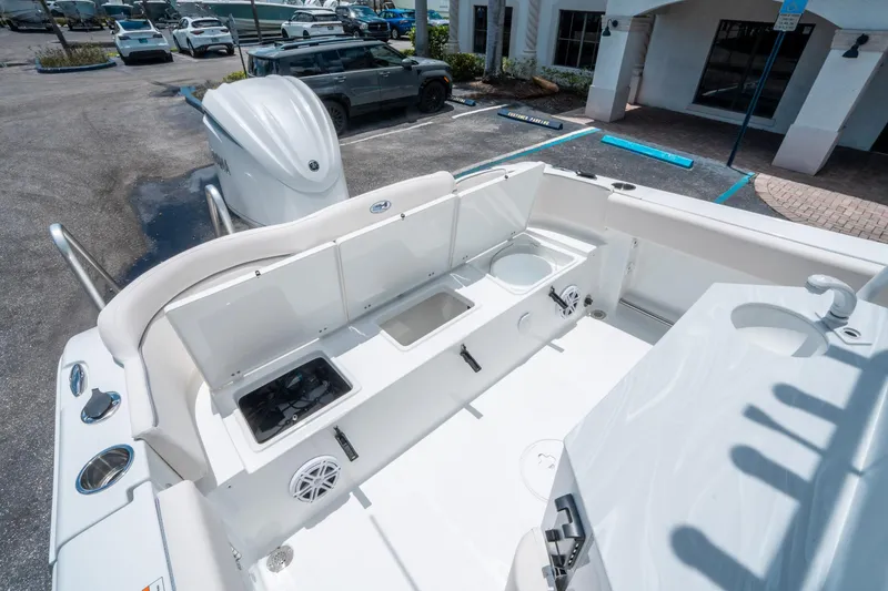 Slide: The Image of 2025 Sea Hunt Ultra 245 SE boat interior with seating and storage compartments. - 14