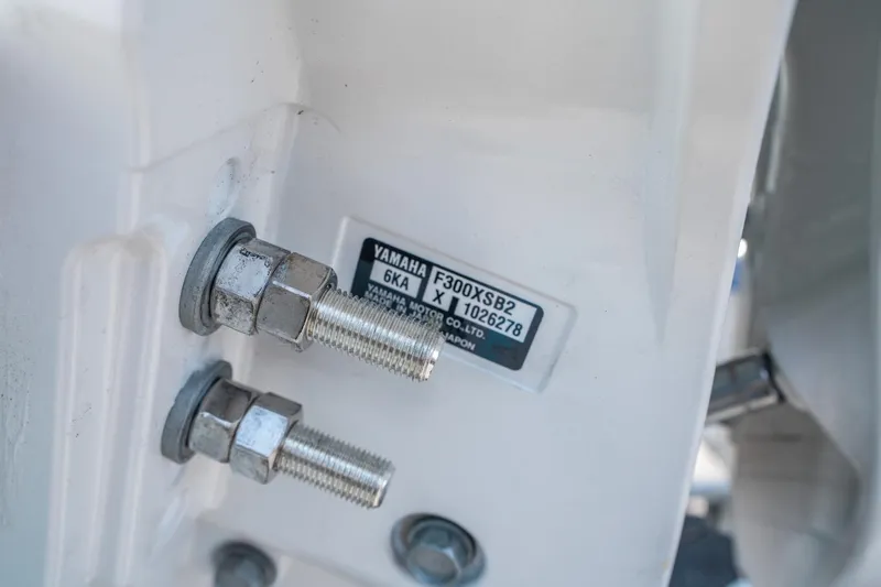 Slide: The Image of Close-up of Yamaha F300XSB2 engine bolts on 2025 Sea Hunt Ultra 245 SE. - 33