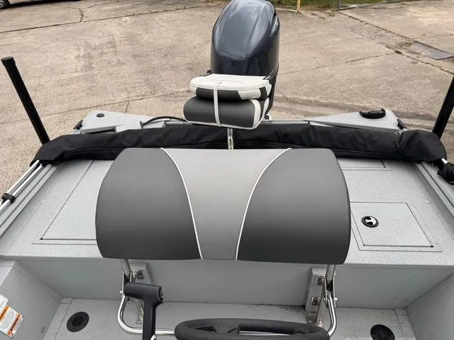 Slide: The Image of 2023 Polar Kraft 190 Sport X boat interior with seating and motor. - 10