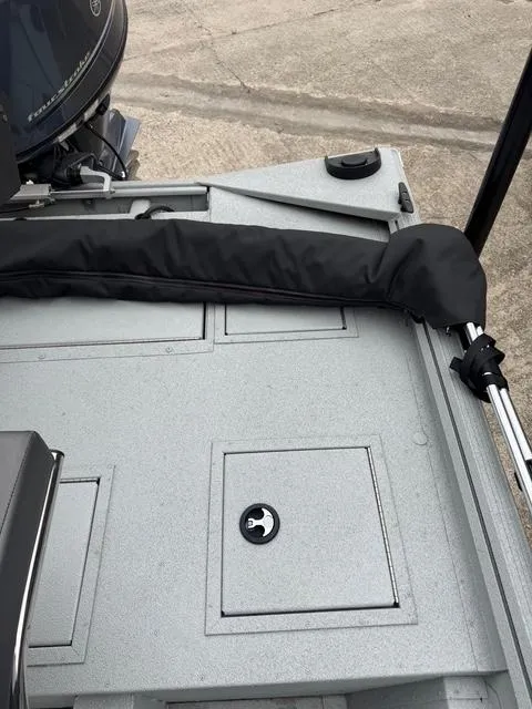 Slide: The Image of 2023 Polar Kraft 190 Sport X boat deck with storage compartments and motor. - 11