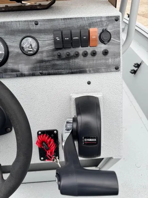 Slide: The Image of 2023 Polar Kraft 190 Sport X boat dashboard with Yamaha throttle and control panel. - 13