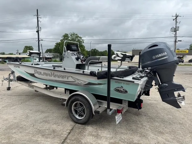 Slide: The Image of 2023 Polar Kraft 190 Sport X boat with Yamaha motor on trailer, parked outdoors. - 3