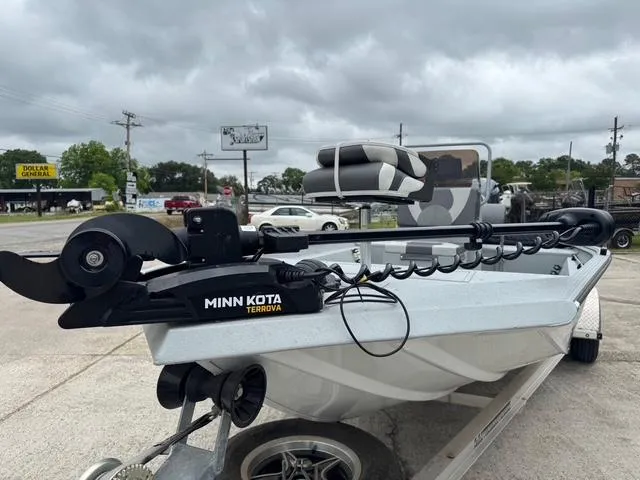 Slide: The Image of 2023 Polar Kraft 190 Sport X boat with Minn Kota Terrova motor, parked outdoors. - 5