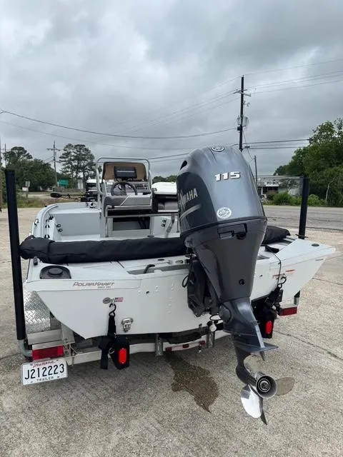 Slide: The Image of 2023 Polar Kraft 190 Sport X boat with Yamaha 115 outboard motor, parked outdoors. - 6