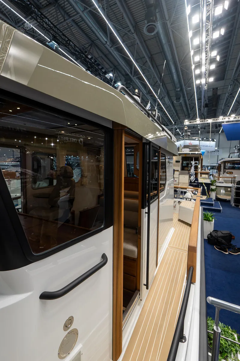 Slide: The Image of 2026 Targa 27 boat showcased indoors with sleek design and modern features. - 11