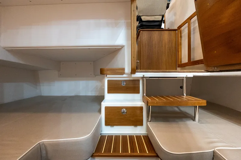 Slide: The Image of Interior of 2026 Targa 27 boat with wooden accents and cozy seating. - 17