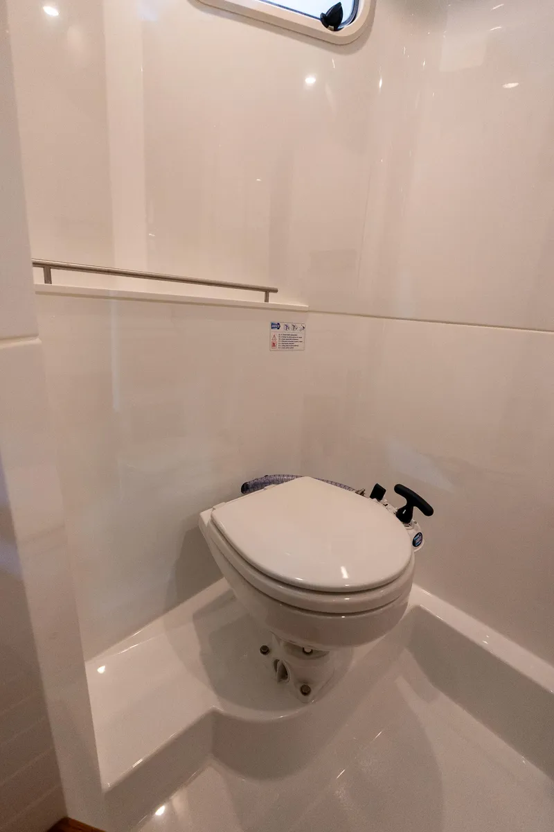 Slide: The Image of Modern bathroom in 2026 Targa 27 boat with sleek white toilet design. - 25