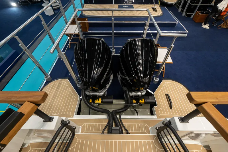 Slide: The Image of 2026 Targa 27 boat with dual outboard engines and teak deck flooring. - 4