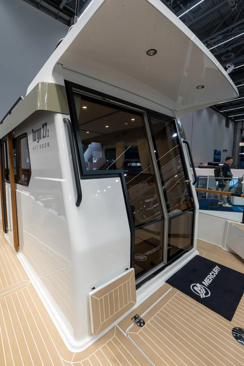Slide: The Image of 2026 Targa 27 boat with sleek design and modern features, showcased indoors. - 5
