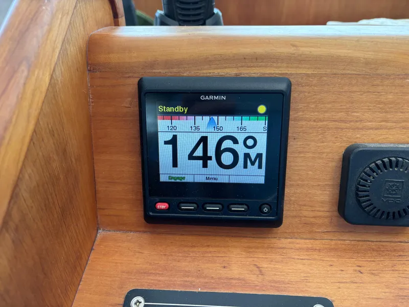 Slide: The Image of Garmin display on 1999 Diesel Duck Trawler showing 146 meters in standby mode. - 12