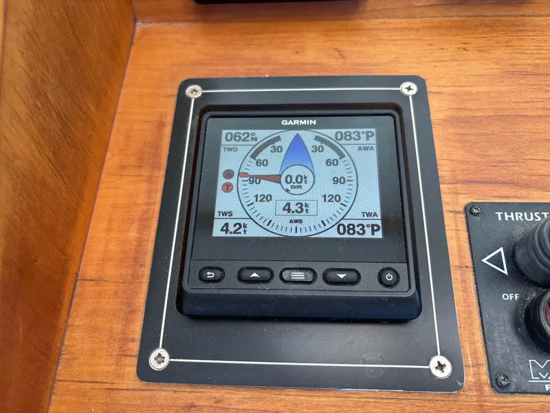 Slide: The Image of Garmin navigation display on 1999 Diesel Duck Trawler, showing wind and speed data. - 13