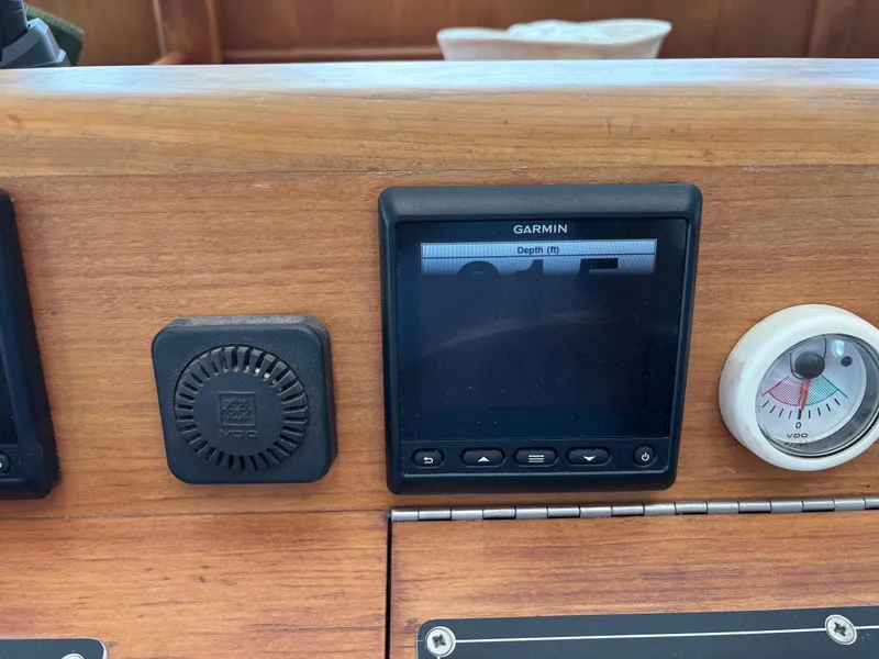 Slide: The Image of Garmin display on 1999 Diesel Duck Trawler dashboard with depth gauge. - 14