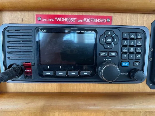Slide: The Image of VHF marine radio on 1999 Diesel Duck Trawler with distress button and call sign display. - 17