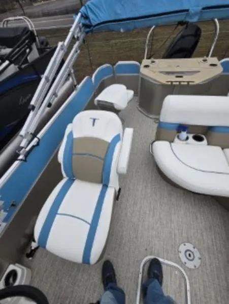 Slide: The Image of 2023 Trifecta 22RFC-CS275 FISH/SKI boat interior with blue and white seating and canopy. - 7
