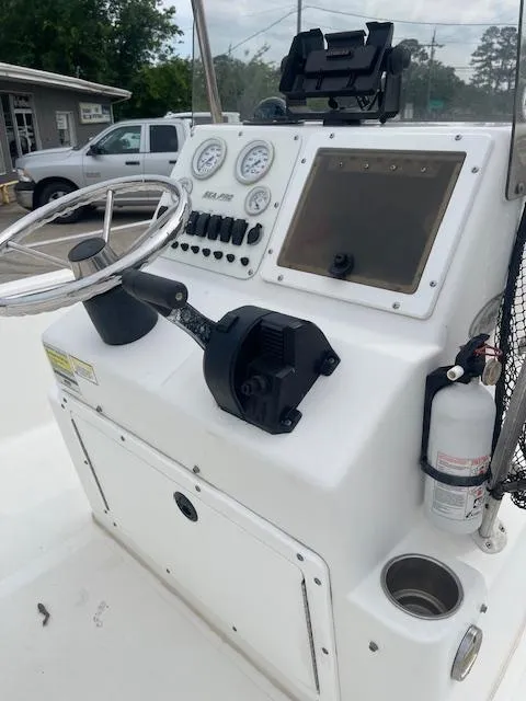 Slide: The Image of 2006 Seapro 2100 CC boat console with steering wheel, gauges, and navigation equipment. - 4