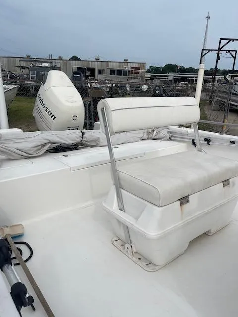 Slide: The Image of 2006 Seapro 2100 CC boat with white seating and Johnson outboard motor. - 7