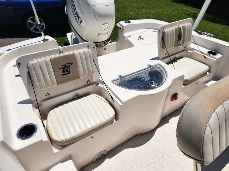 Slide: The Image of 2019 Carolina Skiff 198 DLV boat interior with seating and Suzuki engine. - 13
