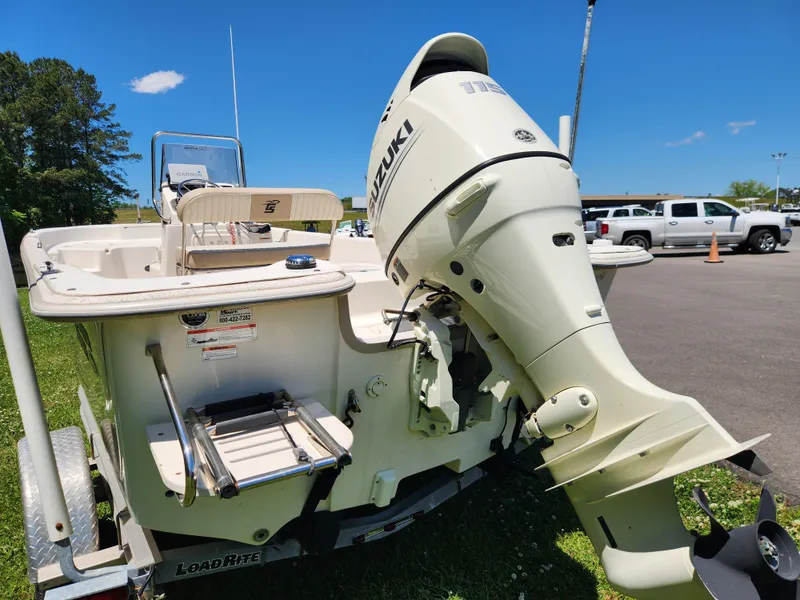 Slide: The Image of 2019 Carolina Skiff 198 DLV boat with Suzuki outboard motor on trailer. - 3