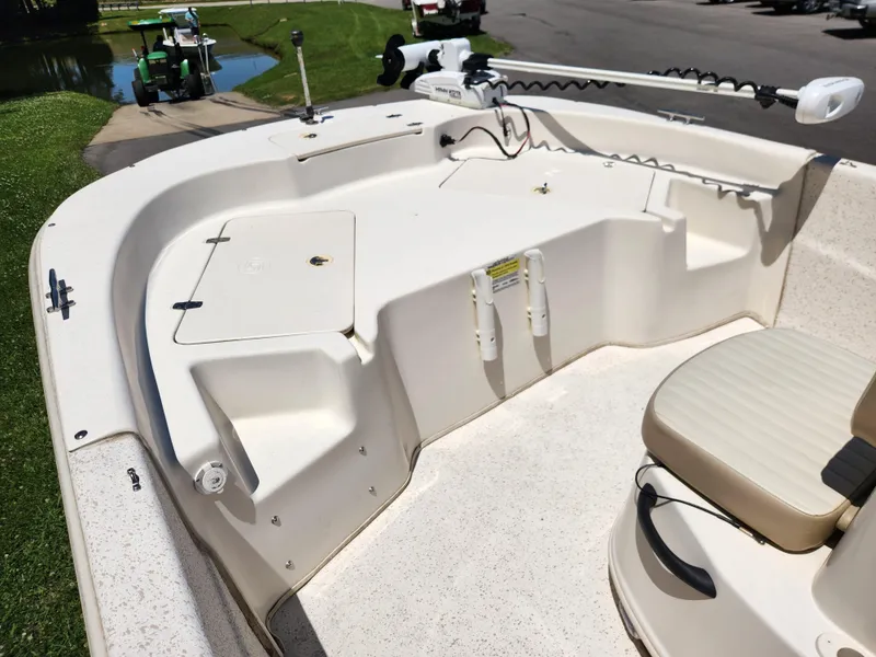 Slide: The Image of 2019 Carolina Skiff 198 DLV boat interior with seating and storage compartments. - 7