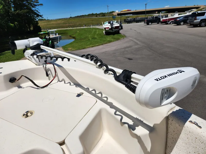 Slide: The Image of 2019 Carolina Skiff 198 DLV with Minn Kota trolling motor in parking lot. - 8
