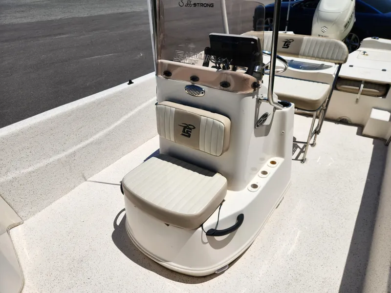 Slide: The Image of 2019 Carolina Skiff 198 DLV boat interior with seating and console. - 9