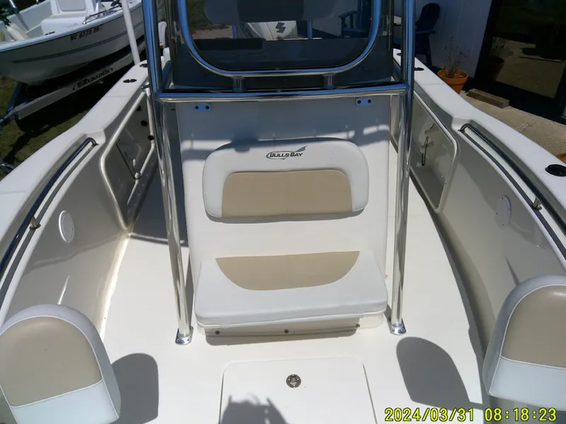 Slide: The Image of 2024 Bulls Bay 200 CC boat interior with seating and console. - 11