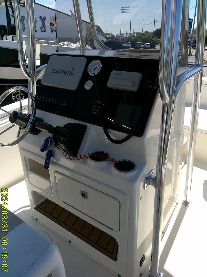 Slide: The Image of 2024 Bulls Bay 200 CC boat console with Garmin navigation system and steering wheel. - 17