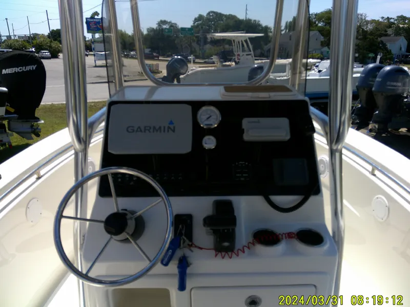Slide: The Image of 2024 Bulls Bay 200 CC boat console with Garmin navigation system and steering wheel. - 18