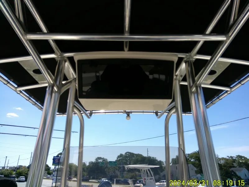 Slide: The Image of 2024 Bulls Bay 200 CC boat with T-top frame and electronics box, sunny day. - 19