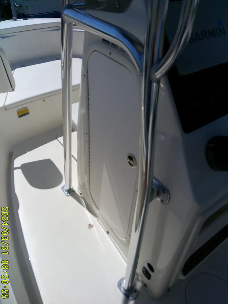 Slide: The Image of 2024 Bulls Bay 200 CC boat console with stainless steel railings and Garmin equipment. - 27