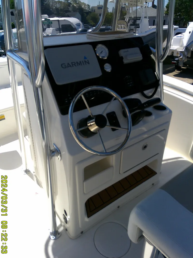 Slide: The Image of 2024 Bulls Bay 200 CC boat console with Garmin navigation system and steering wheel. - 29